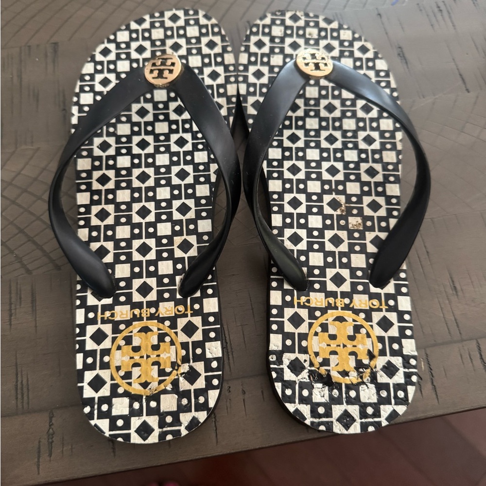 Tory Burch Black and Gold Patterned Flip Flops